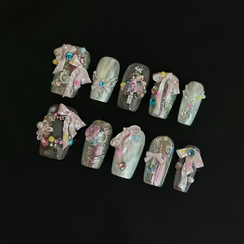 A nail art mold with ribbon bo - مراجعة Nail Art Elegant وسعره